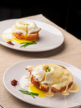 Breakfast is Eggs Benedict - toasted English muffins, bacon, ham, poached eggs, herbs and delicious buttery hollandaise sauce.
