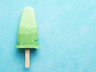 Superfood matcha tea popsicle on blue background.Ideas and recipes for healthy breakfast,summer...