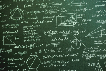 Math on dark green board with many solution