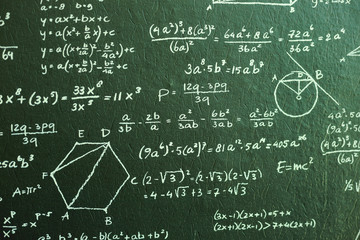 close up Math on dark green board with many solution