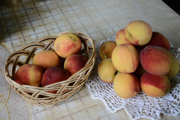 Fresh fragrant and sweet peaches in the basket