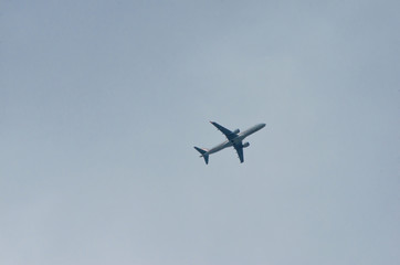 airplane on a gray sky background