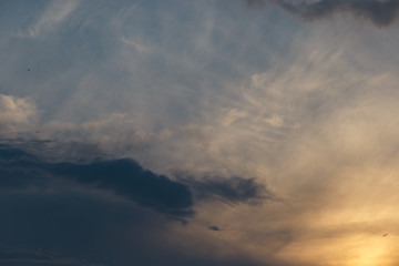 Dramatic sunset sky with clouds. Colorful sunset. Background at dark sky