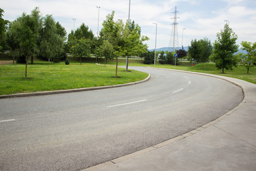 empty concrete car road in outdoor green street
