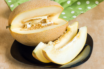 Ripe melon on wooden table background. Healthy vitamin eating.