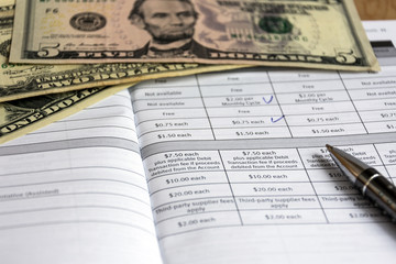 Finance accounting.. Paycheck and currency top view.	