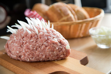 German cuisine with minced pork meat, onions and bread rolls