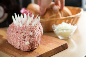 Ground raw pork meat with onions and bread rolls for German party buffet