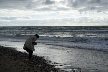 collect stones on the seashore