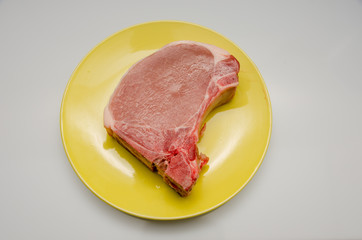meat lies on a plate, appetizing meat for cooking
