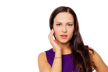 Fototapeta premium Young brunette woman in purple dress, isolated on white
