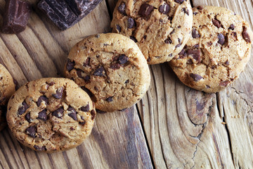 Chocolate cookies on table. Chocolate chip cookies shot with chocolate