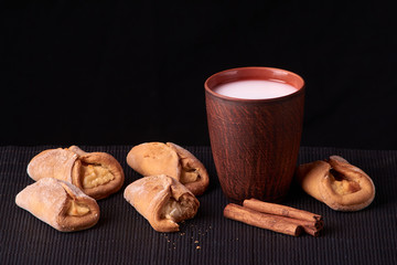 Cottage cheese homemade cookies and cold milk in glass. Close-up. Selective focus.