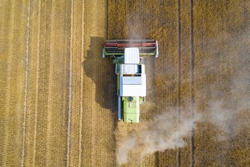 Aerial view of harvester combine working on field