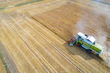 Aerial view of harvester combine working on field