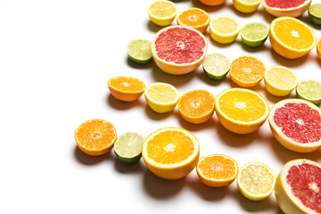Citrus fruit background. Slices of grapefruit, orange, lemon and lime