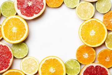 Citrus fruit background. Slices of grapefruit, orange, lemon and lime