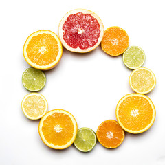 Citrus fruit background. Slices of grapefruit, orange, lemon and lime