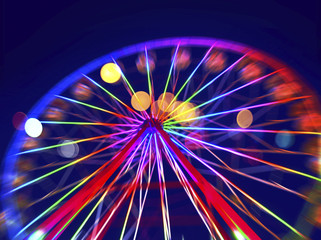 Defocused ferris wheel with colorful lights, Blur abstract background ready for your design - Powered by Adobe