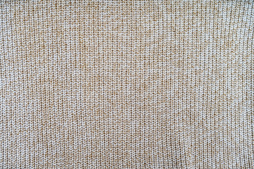 background and texture of knitted woolen or cotton fabric closeup
