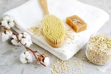 Natural Ingredients for Homemade Body Oatmeal Scrub Soap White Towel Beauty Concept Skincare Organic Wooden Body Massage Brush Aroma Spa Therapy Cotton Flower