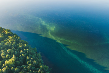 Fototapeta na wymiar Blue water texture aerial drone view