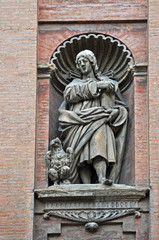 Fototapeta na wymiar Italy, Bologna Saint John evangelist statue attributed to Giovanni Tedeschi in the front of Santissimo Salvatore church.