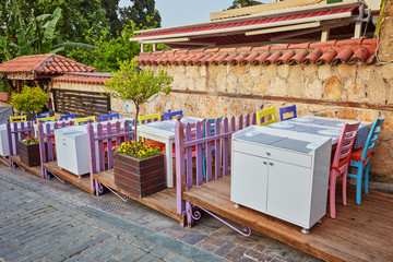 street cafe with wooden chairs and tables