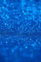 Blue bokeh background of glitter lights