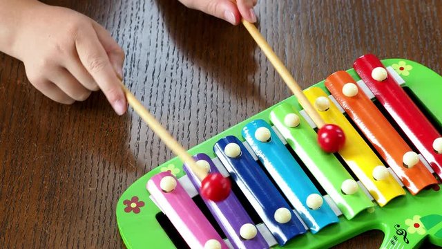 Musical instrument xylophone. Child playing on xylophone, musical instrument.