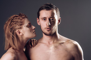 girlfriend and boyfriend with gold on body. girlfriend and boyfriend in love relations or...
