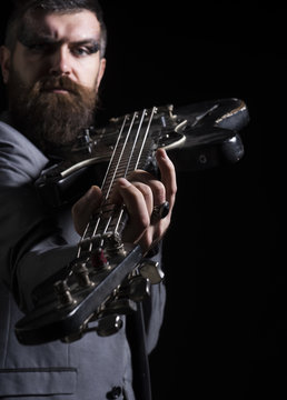 Guitar player hold electric instrument. Bearded man play guitar chord. Musician with guitar. My guitar gently weeps