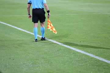 Fototapeta premium Linesman soccer referee with flags