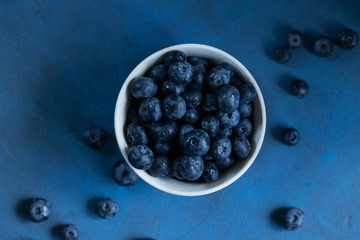 blueberries on blue flatlay close-up