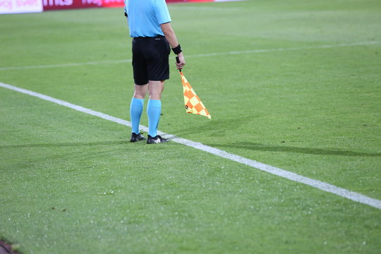 Linesman soccer referee with flags