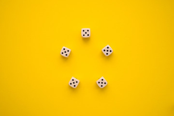 dice on a yellow background