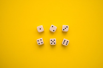 dice on a yellow background