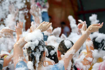 People dancing at the foam party