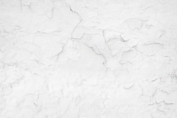 Cracked paint on a white wall texture