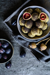 Sweet plum dumplings with poppy seeds