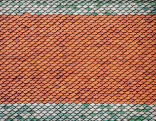 Fototapeta premium Brick roof tiles on roof of a country house of Thailand