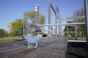 Lensball in front of a street workout machines in a park