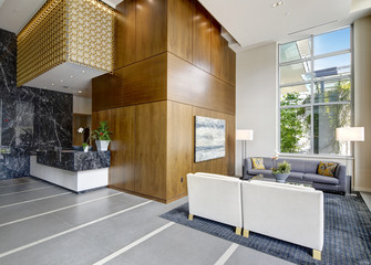 Spacious lobby area in a modern luxurious condominium.