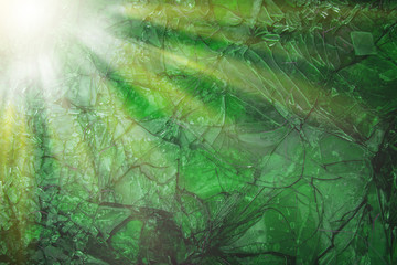 Fototapeta na wymiar Green background broken light glass