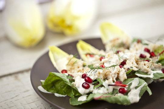 Crabmeat salad with chicory and pomegranate seeds 