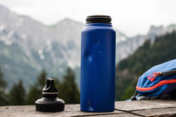 tourist water bottle on the background of mountains
