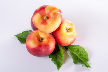 New hybrid sweet fruit nectarina platerina, flat Saturn or donut nectarine peaches close up