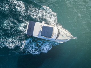 sea service team in fast speed motor boat top overhead view