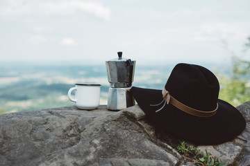 coffee the and hat outdoors. Adventure, travel, tourism and camping concept. Concept adventure active vacations outdoor. Summer camping.