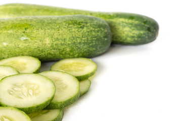 Fresh cucumber slices on white background